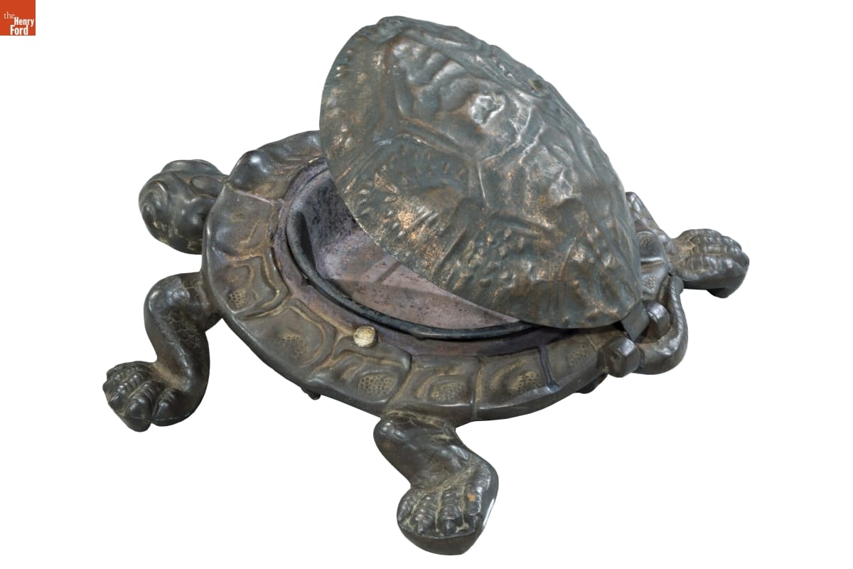 Spittoon Metal turtle whose shell opens to reveal a bowl inside