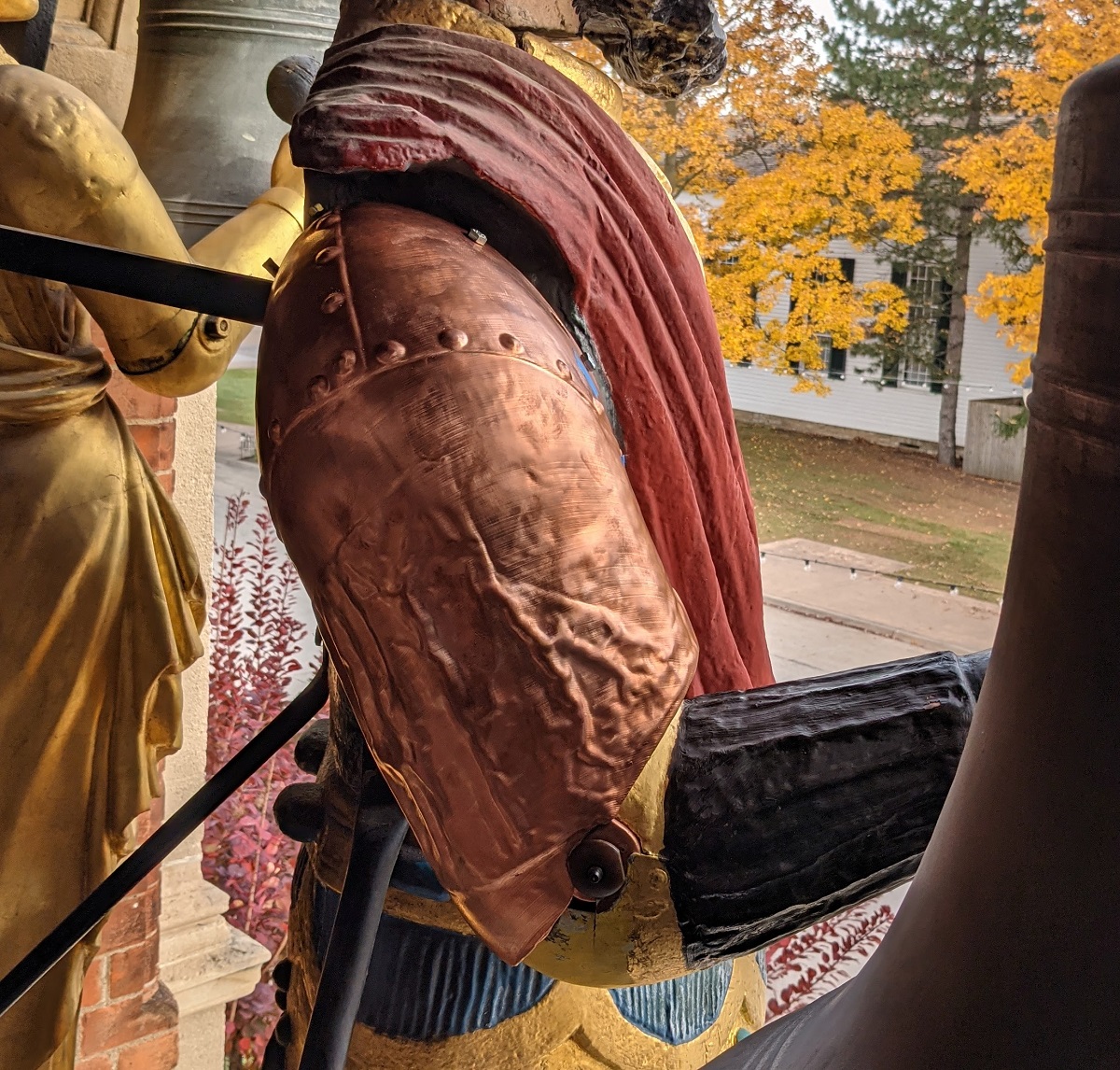 Test for fitting the plated arm onto Magog Statuary figure from the side, showing copperplated arm