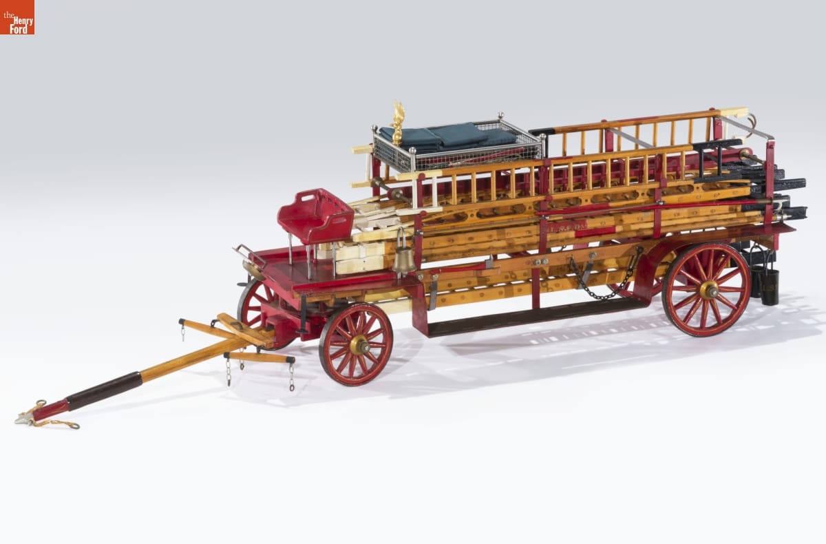 Model of a Hook and Ladder Truck, circa 1900 Wooden fire truck with red wheels