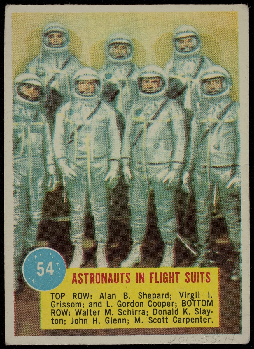 Topps Astronaut Trading Card, "Astronauts in Flight Suits," 1963 Trading card with image of seven people in silver suits; also contains text