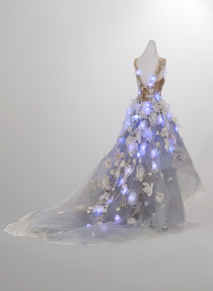 "Cognitive Dress," Designed by IBM and Marchesa, 2016 Back view of dress on dress form with glowing blue lights integrated into bodice and skirt
