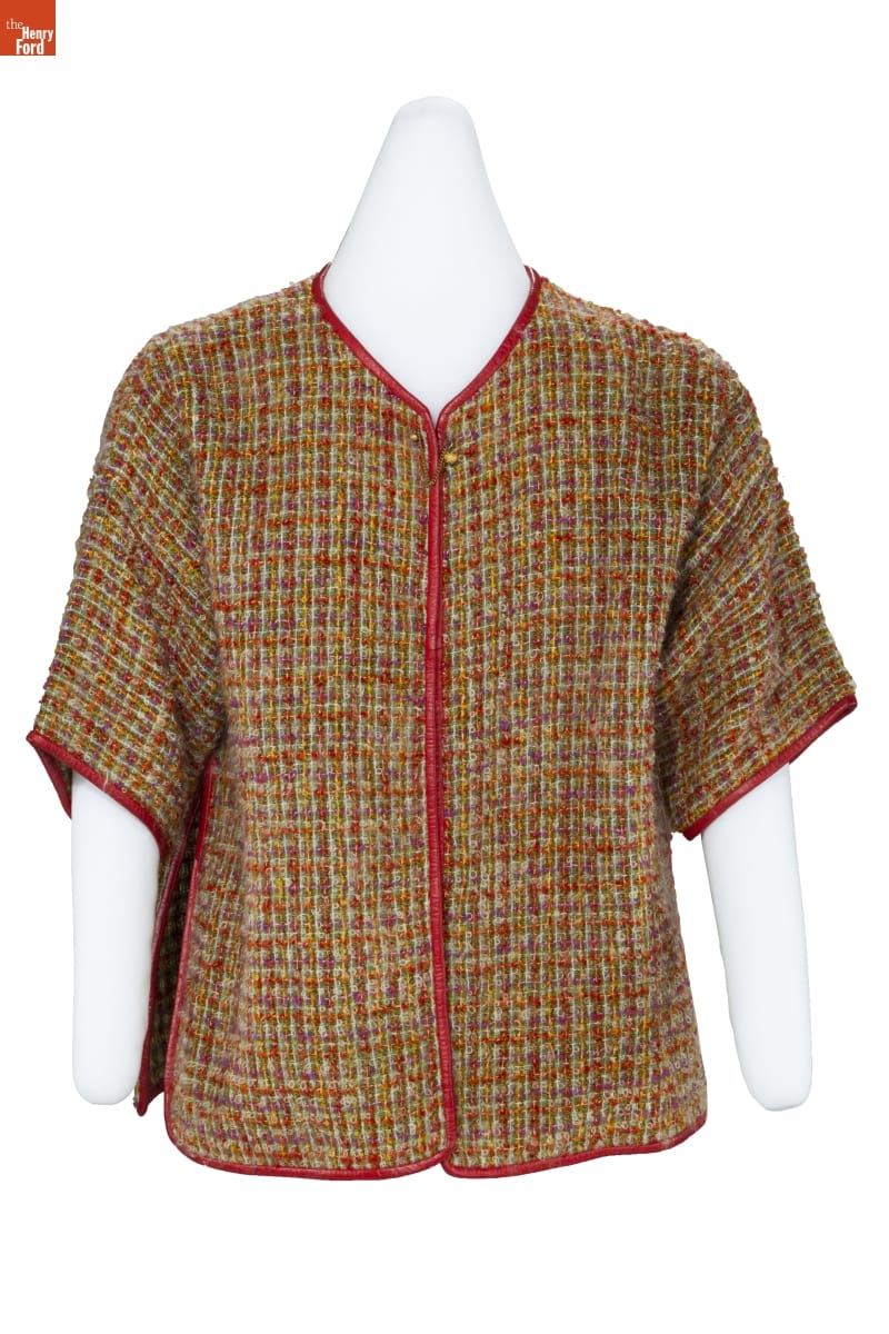 Shirt with nubbly yellow, red, and beige plaid pattern, elbow-length sleeves, and red leather piping down the placket