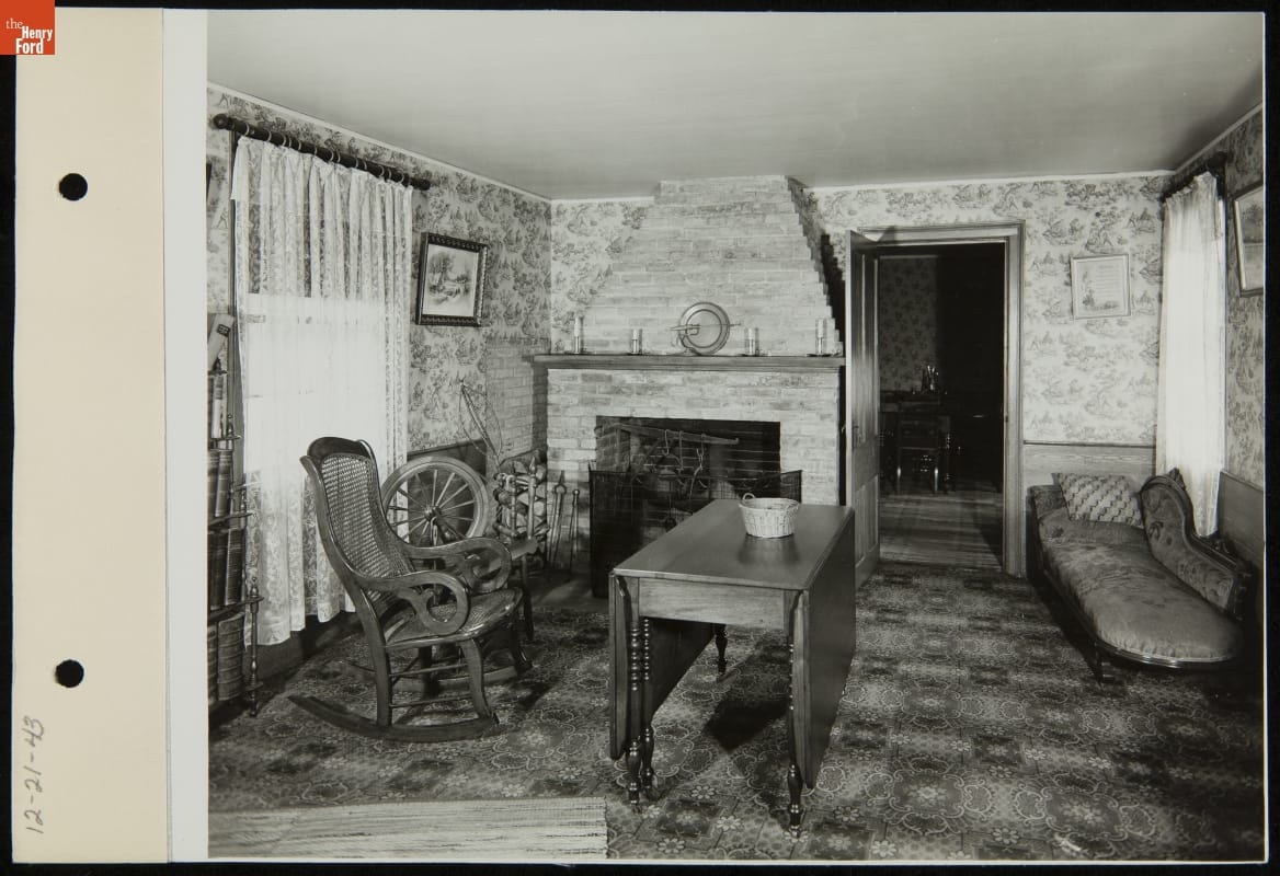 Everyday parlor inside Ford Home, 1943. “Personal Memoirs of U.S. Grant” are visible on the book stand’s third shelf.