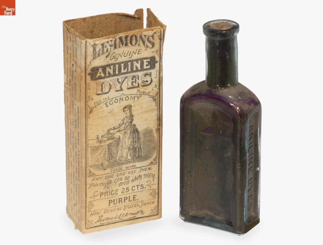 Wells, Richardson & Company "Leamon's Genuine Aniline Dyes: Purple," 1873-1880 Purple glass bottle sitting next to box with images and text