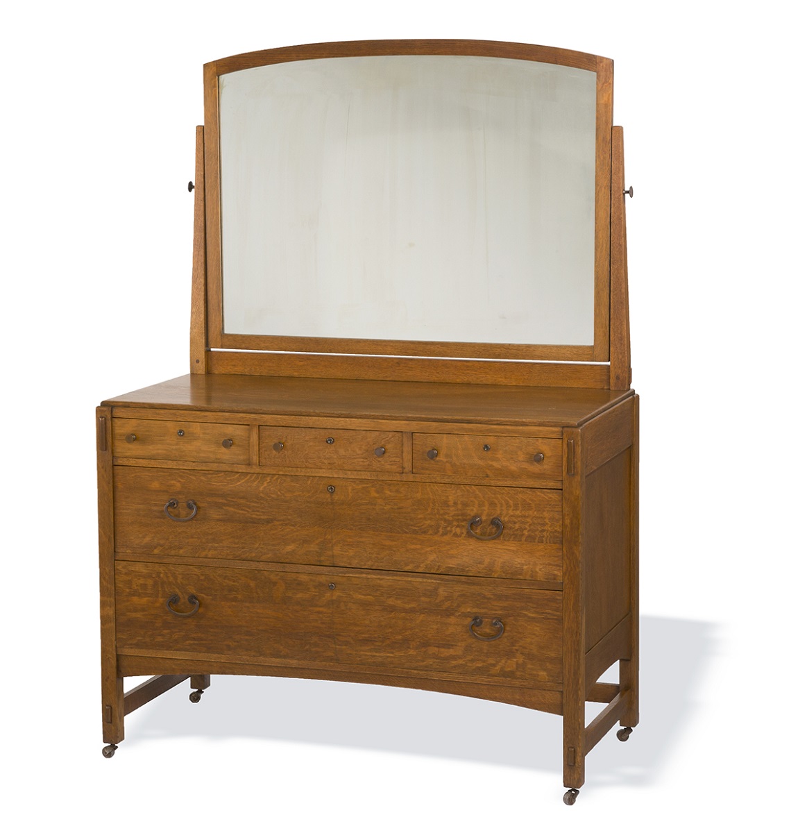 Wooden dresser topped with large mirror
