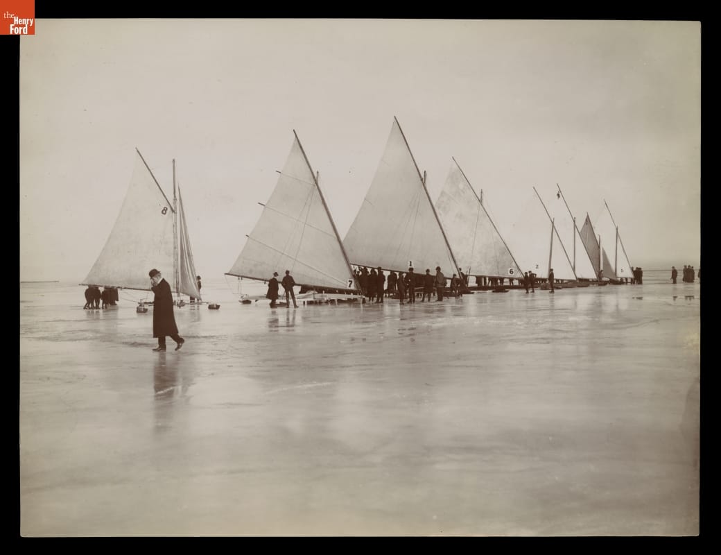 Ice Yachting, Lake Saint Clair, circa 1900 Conveyances with sails on ice with people standing around them