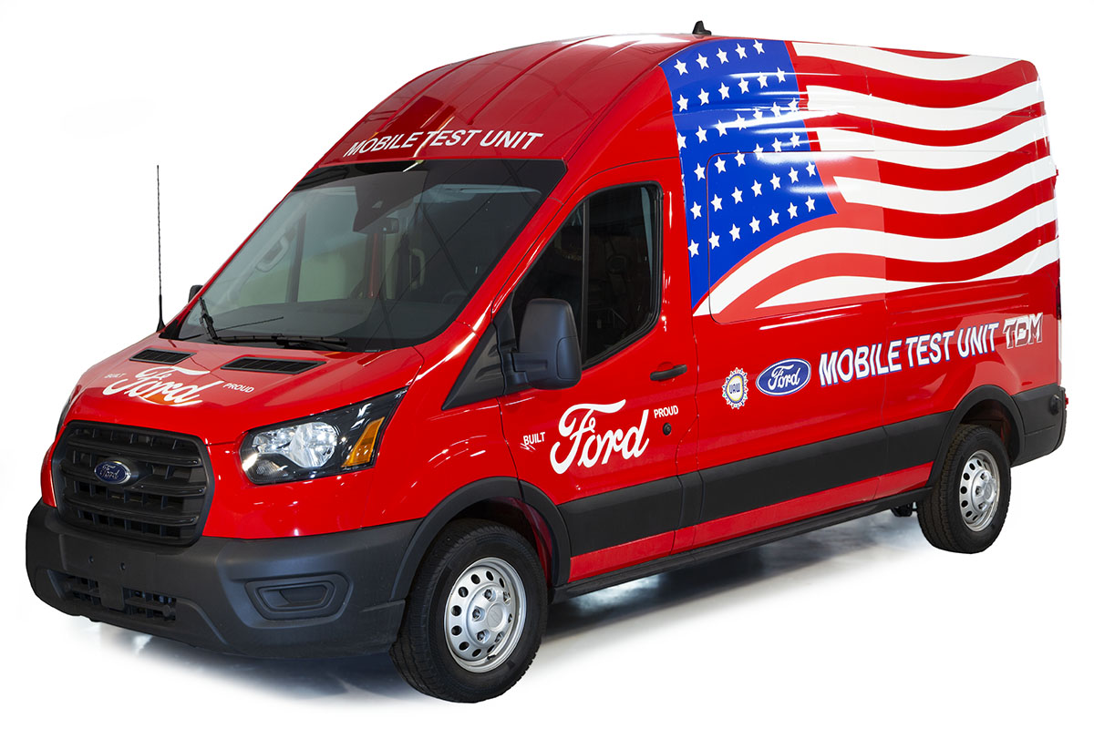 Ford Transit Van, Modified for Use as a COVID-19 Mobile Testing Facility, 2020 Tall red van with text and large waving American flag on side