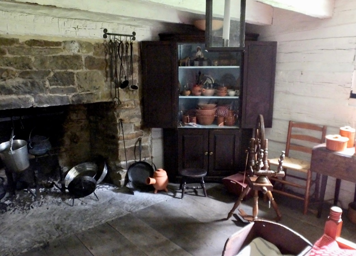 Interior of William Holmes McGuffey Birthplace Room interior showing large stone fireplace and a variety of old-fashioned furnishings