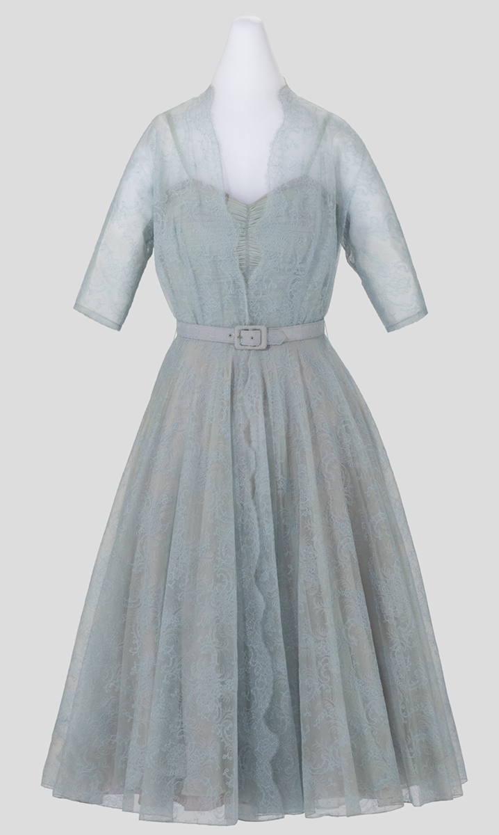 Gothe' Dress, Worn by Catherine Prindle Roddis, circa 1948 Light bluish-gray lace dress with translucent three-quarters sleeves, full shirt, and sweetheart bodice