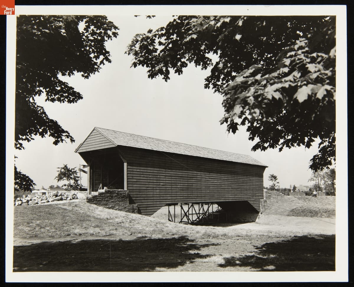 Ackley Covered Bridge in Greenfield Village after Construction, June 30, 1938 Covered bridge over dry streambed