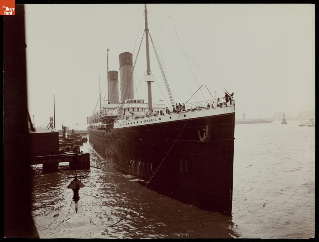 "Docking a Big Liner," RMS Oceanic, 1903 Black-and-white photo of large ship at dock