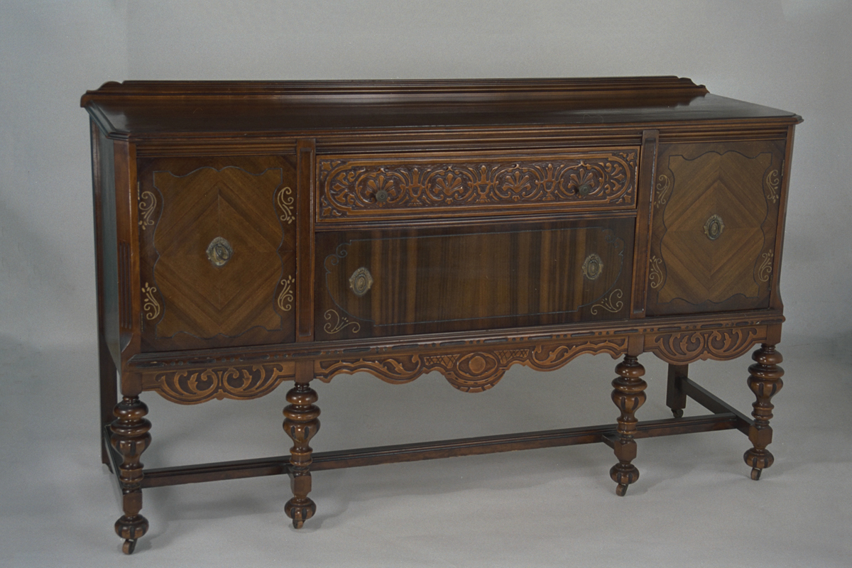 Wooden sideboard with carved legs and carving and inlay on body