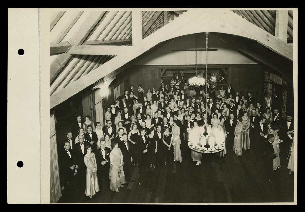Formal Dance at Dearborn Country Club, 1931 Aerial shot of group of people in suits and formal gowns in a ballroom