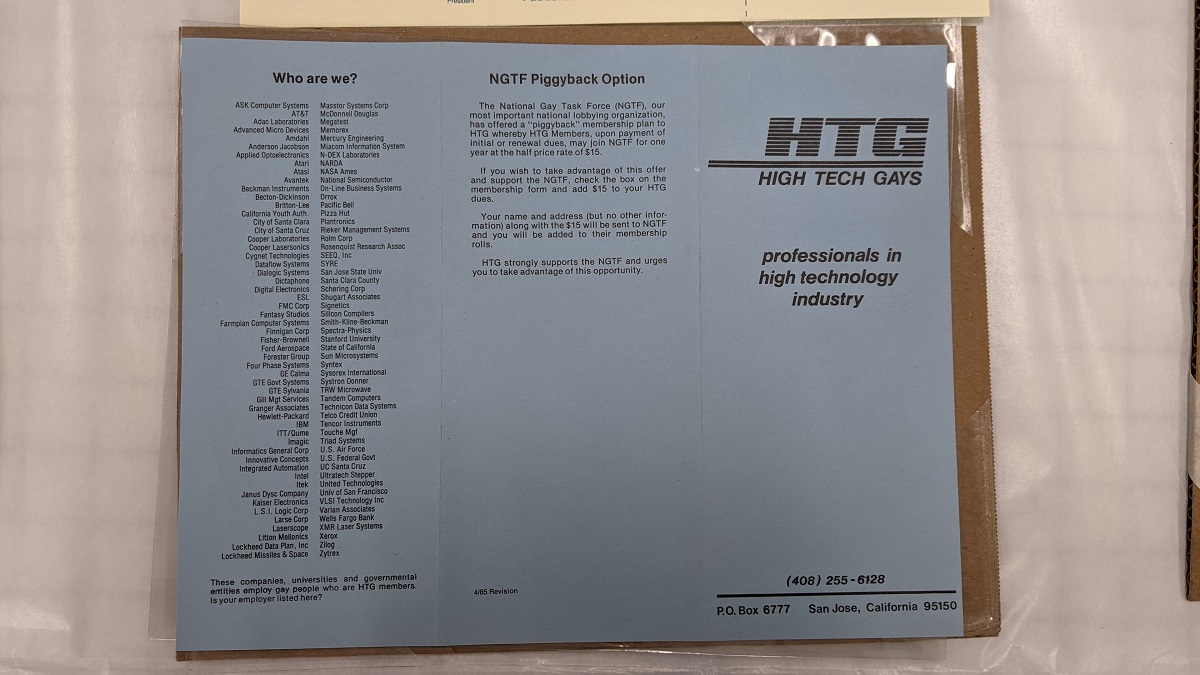 Tri-fold page with text under plastic mounted on cardboard