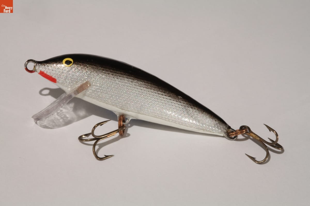 "Sinking Minnow" Lure, 1960-1972 Lure shaped and colored like a fish, with three-pronged hooks hanging from the tail and belly