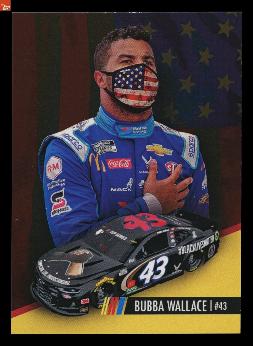NASCAR Cup Series Driver Bubba Wallace Trading Card, 2020 Illustration of man in blue jumpsuit wearing American flag face mask with hand over heart, above illustration of black race car; also contains text