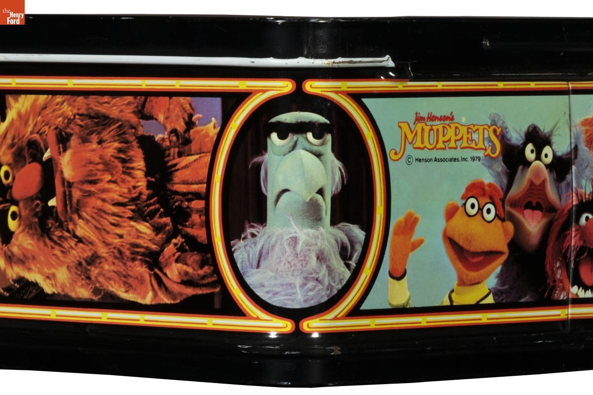 "Jim Henson's Muppets" Lunchbox, 1979 / corner with Sam the American Eagle Corner of lunchbox with image of eagle puppet in center and other puppets on either side; also contains text