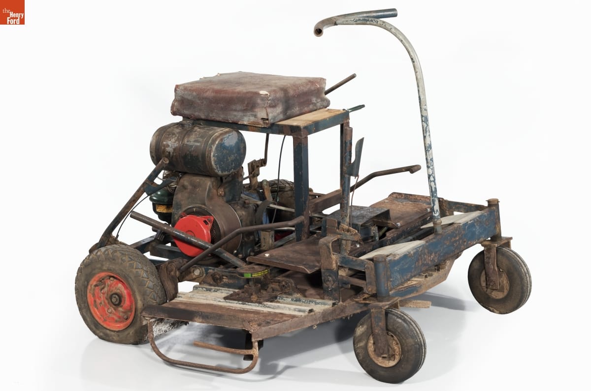 "Blue" Riding Mower, 1956-1958 Wheeled cart with machinery on top of it