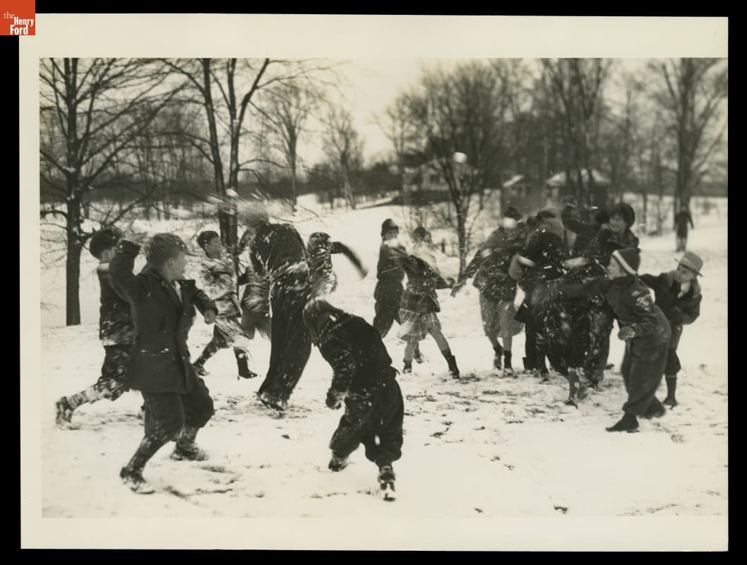 Snowball Fight in Greenfield Village, December 1935 Group of children in a snowy field with trees throwing snowballs at each other