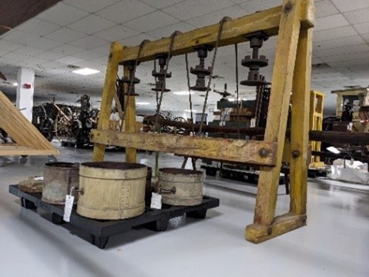 Cheese Press Cheese press with hoops that produce different sizes of cheeses