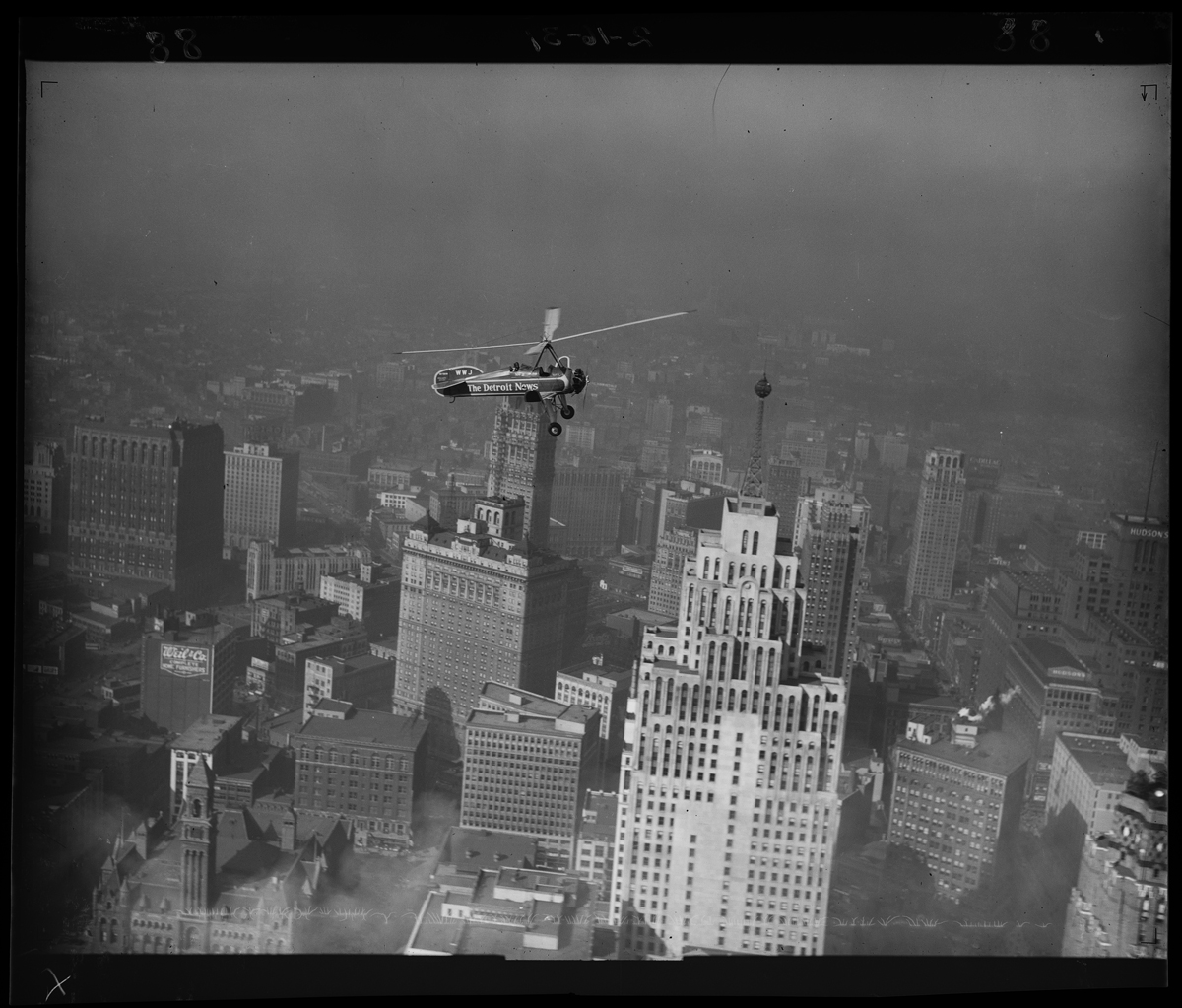 Detroit News--Autogiro--Over Downtown Detroit--Item 15 Aircraft flying over tall buildings