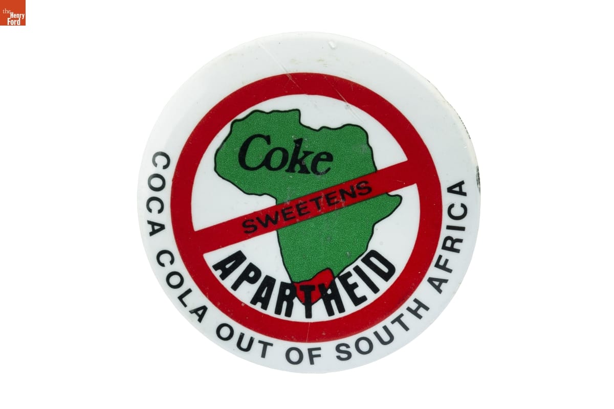 THF196995 'Coke Sweetens Apartheid: Coca Cola Out of South Africa' button, circa 1985, created by the American Friends Service Committee for its Coke Boycott Campaign.
