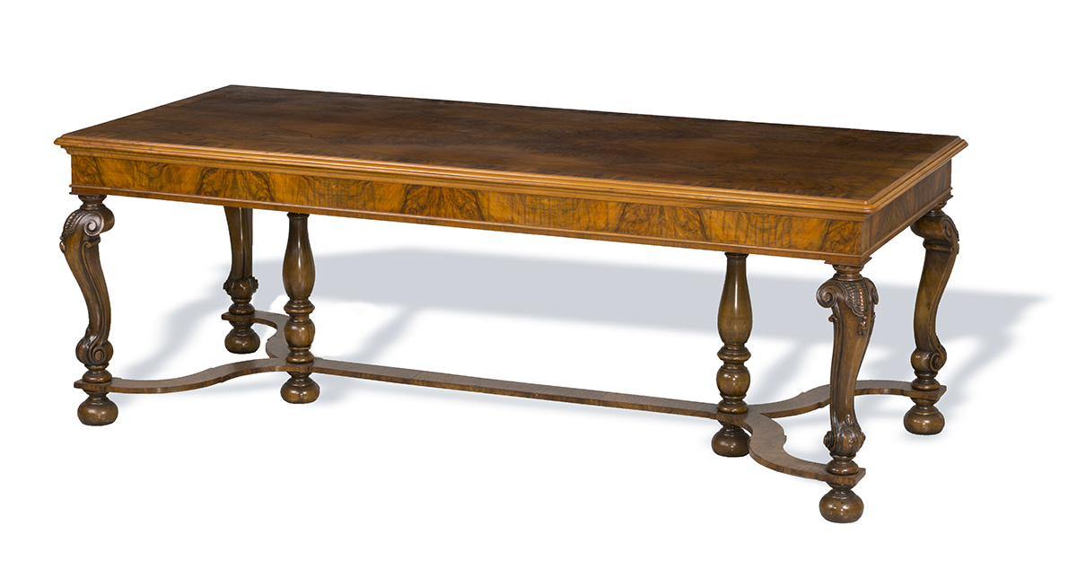 Library Table, Made 1923, Used by Edsel B. Ford at the Ford Motor Company Engineering Laboratory Long, narrow wooden table with decorative legs