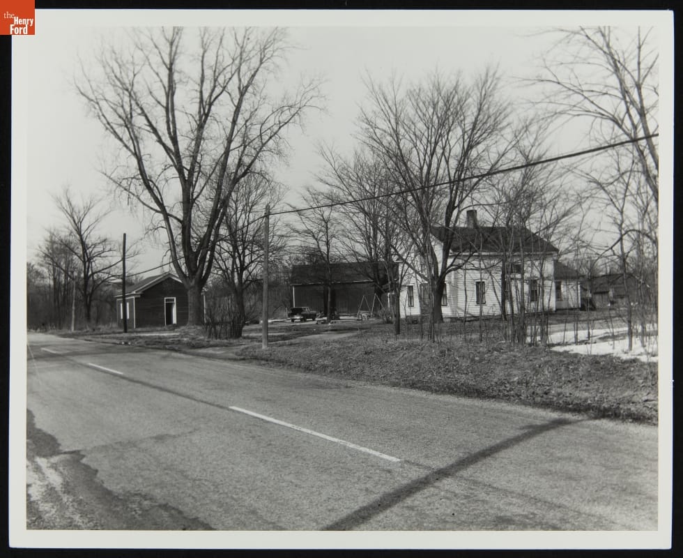 Dr. Howard's Office at Its Original Site, Tekonsha, Michigan, March 1956 Three buildings among trees along a road