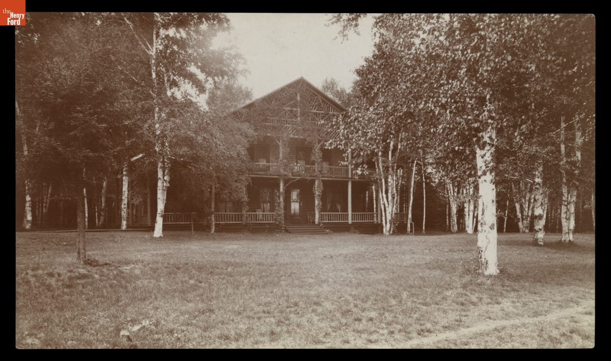 Cottage, Saranac Inn, Upper Saranac Lake, Adirondack Mountains, 1906-circa 1910 Black-and-white photo of two-story wooden building among trees
