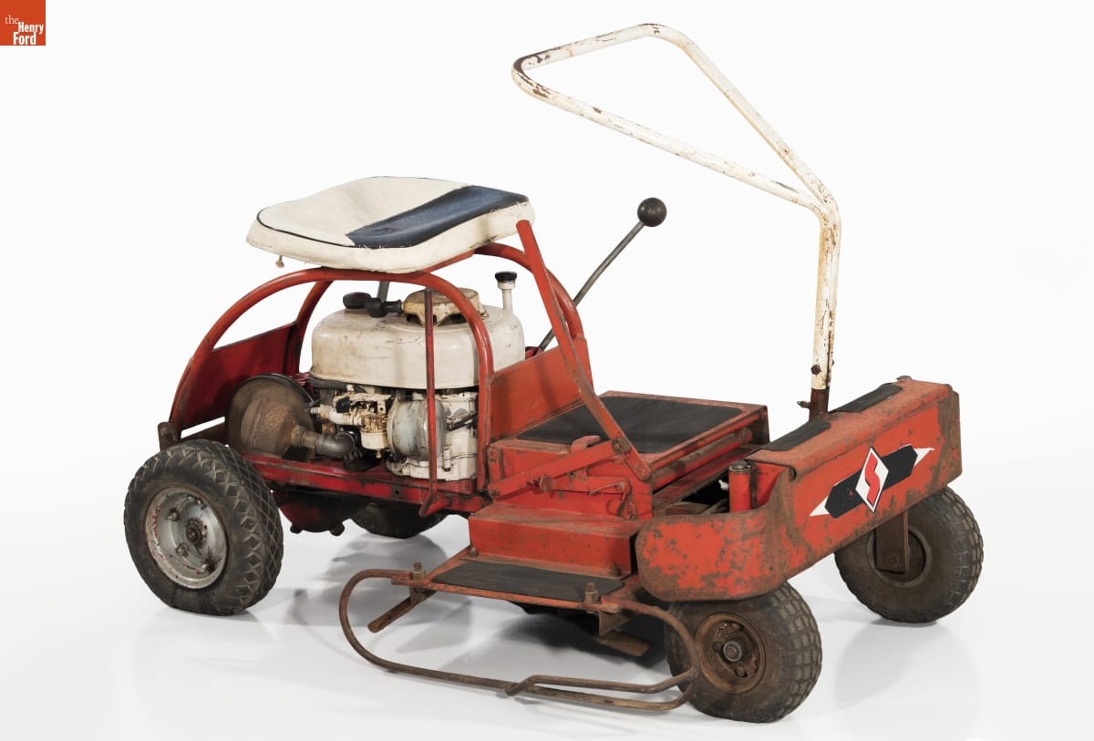 Riding Lawn Mower Production Model, circa 1964 Simple red riding lawnmower with white seat and triangular handle