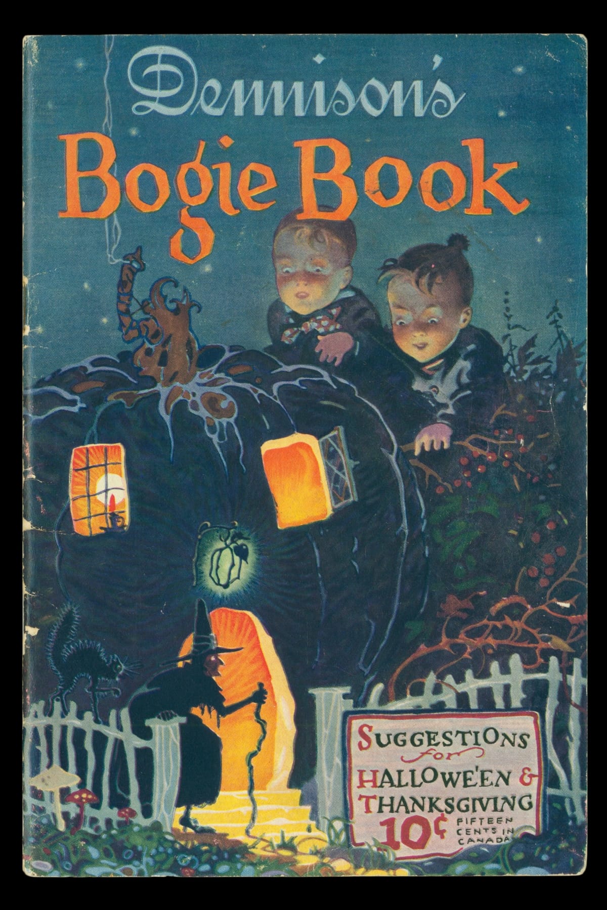 Two children look at a black pumpkin house with Halloween symbols nearby and text