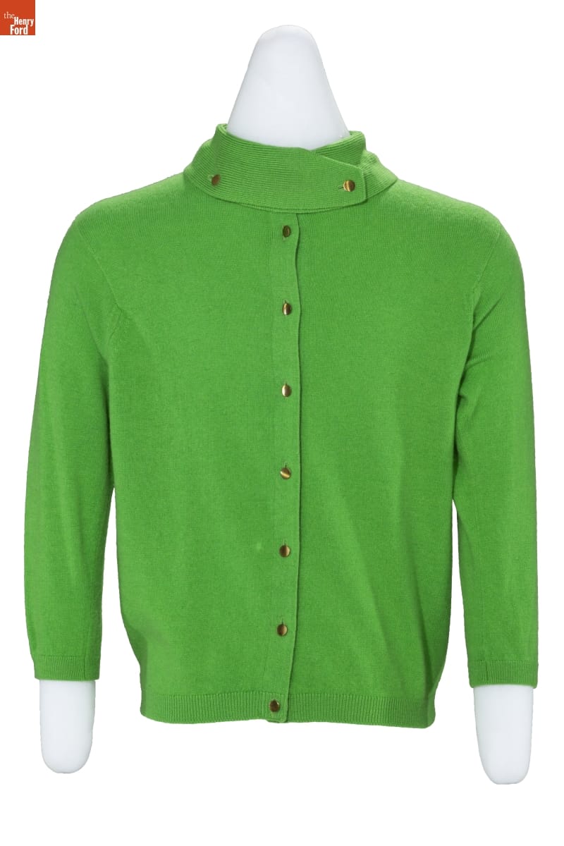 Apple green sweater with three-quarter sleeves and small buttons up the front