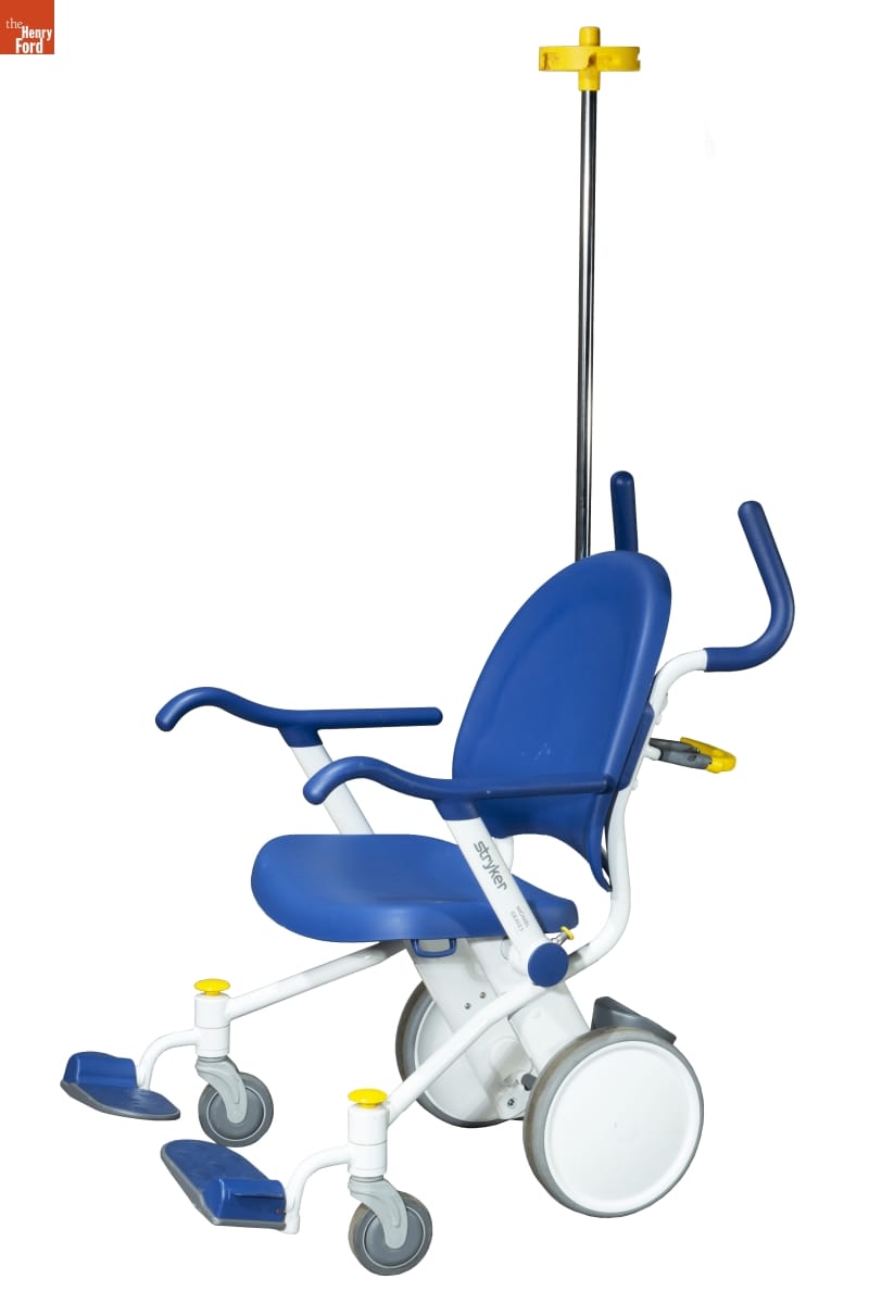 Wheelchair with white plastic frame and blue plastic seat and seat back