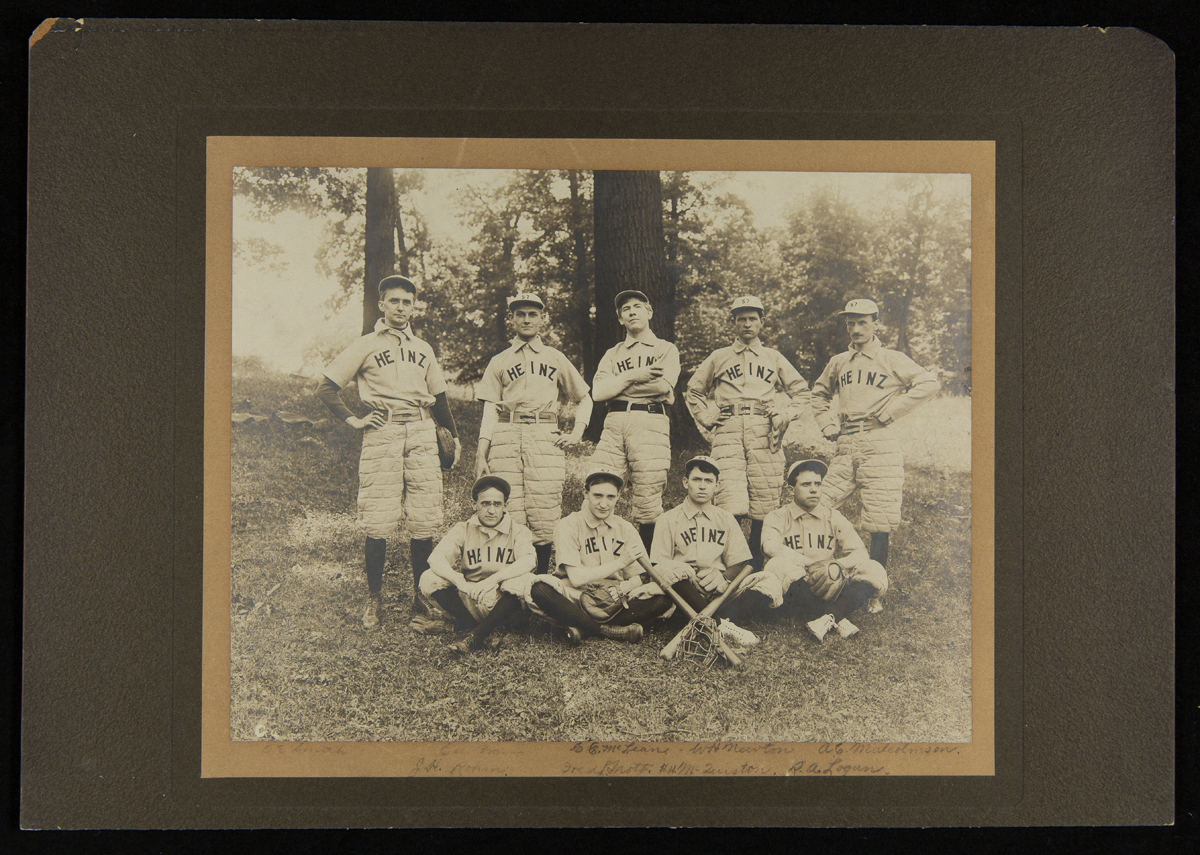 H. J. Heinz Company Baseball Team, circa 1907 Group of nine men wearing baseball uniforms, some sitting and some standing, some with bats