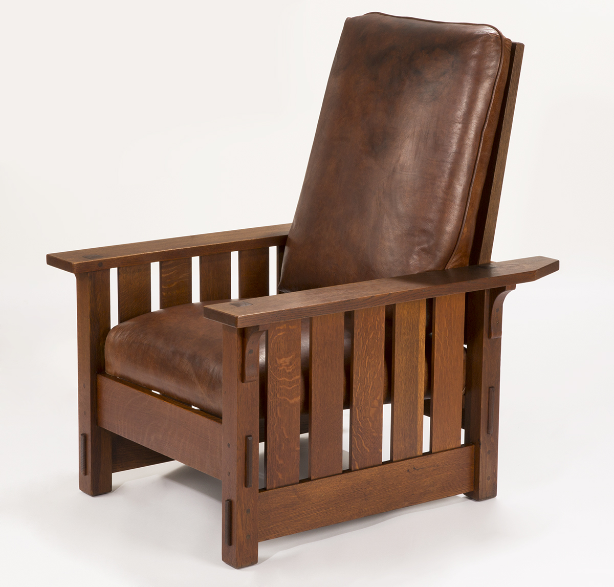 Armchair with wooden, slatted slides and brown leather upholstered seat and back