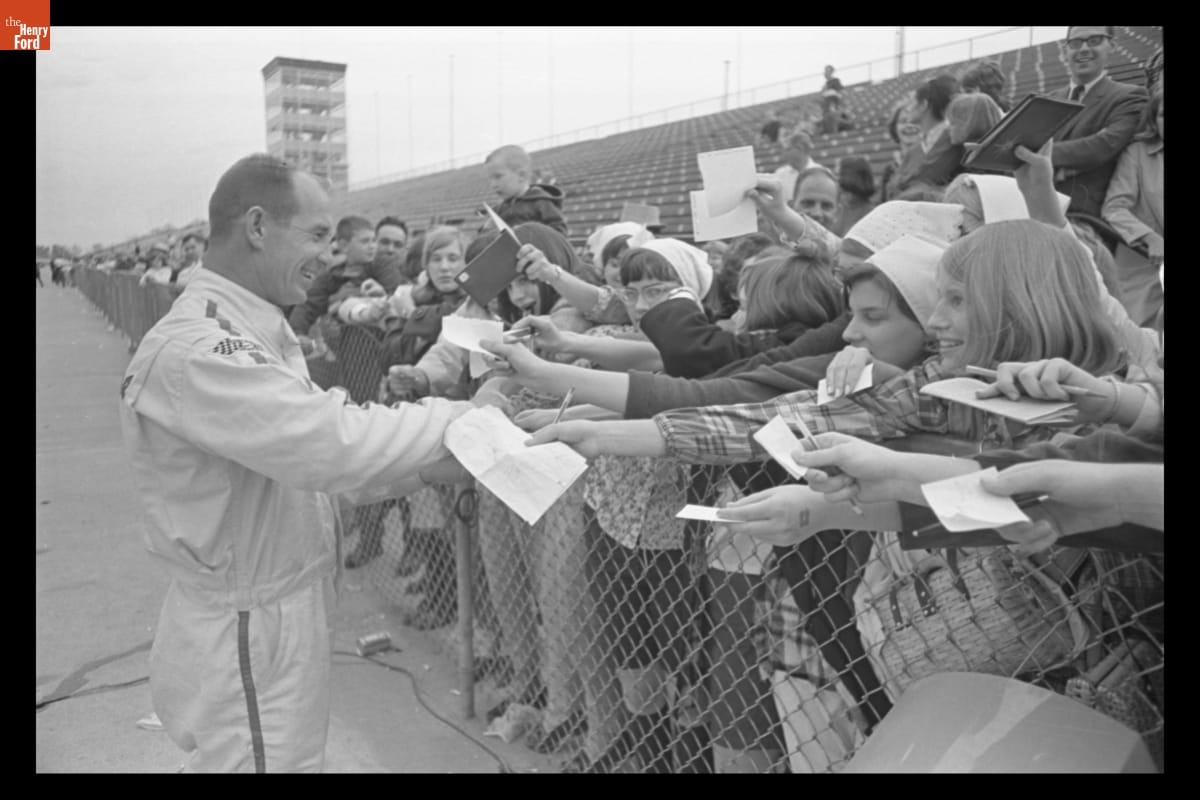Parnelli Jones signing autographs at Indianapolis Motor Speedway, 1967