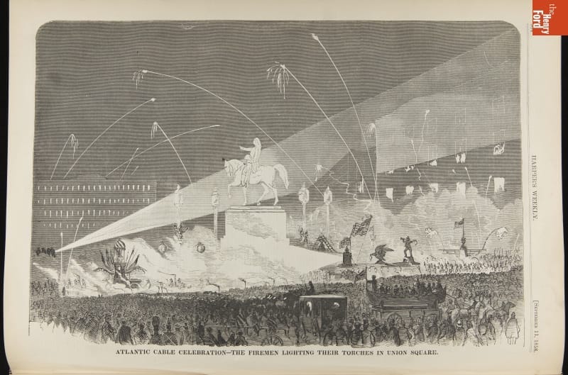 Etching with crowd of people, statue, fireworks and lights in a night sky; also contains text