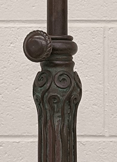 Lamp detail, before and after treatment GIF showing two images of part of a lamp stem; the first is dark and dull and the second is lighter and shiny