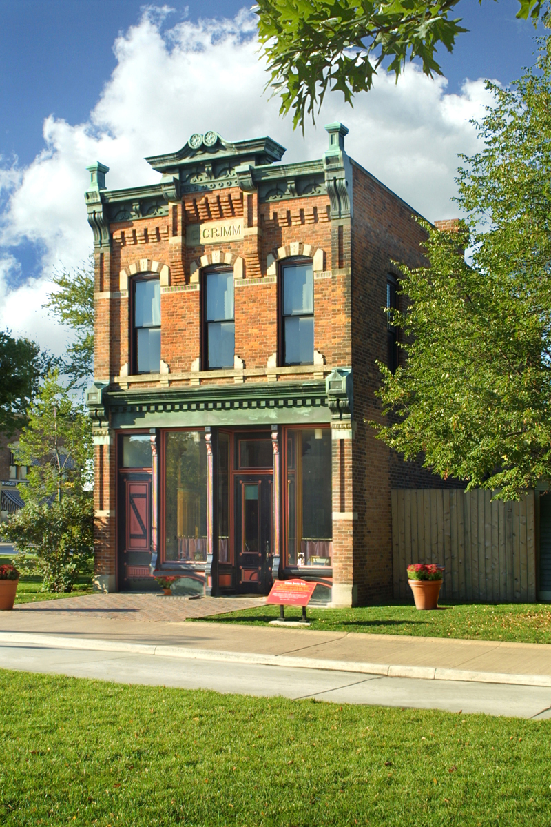 Two-story brick building with many decorative elements