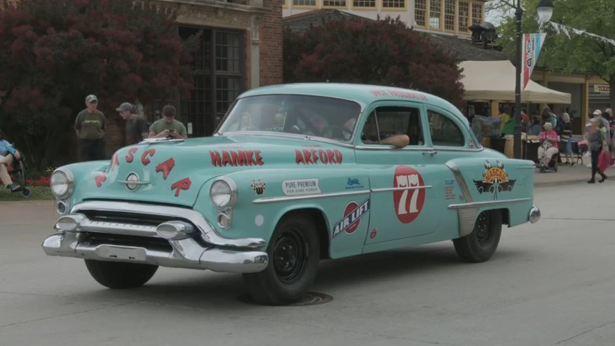 1953 Oldsmobile 88 stock car Turquoise car with text and logos on body and hood