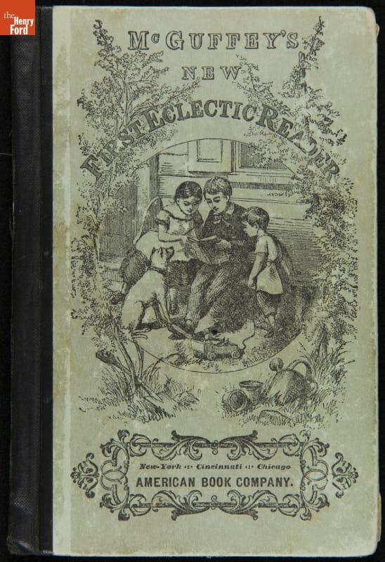 "McGuffey's New First Eclectic Reader," Originally Published in 1885, Reprinted by Henry Ford, 1930 Book cover with text and image of children reading with a dog