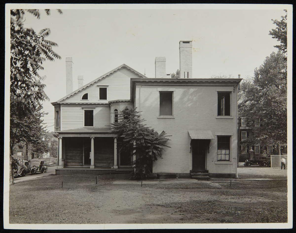 Exterior of the Noah Webster House at its Original Site, New Haven, Connecticut, 1936 Back of two-story wooden building with porch, columns, and square addition to right side