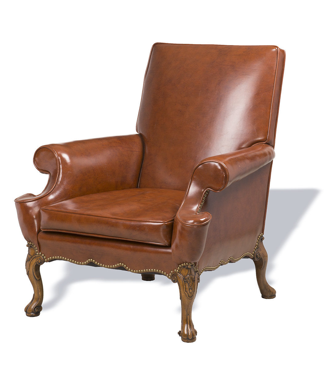 Easy Chair, Made 1923, Used by Henry Ford at the Ford Motor Company Engineering Laboratory Brown leather easy chair with wooden legs