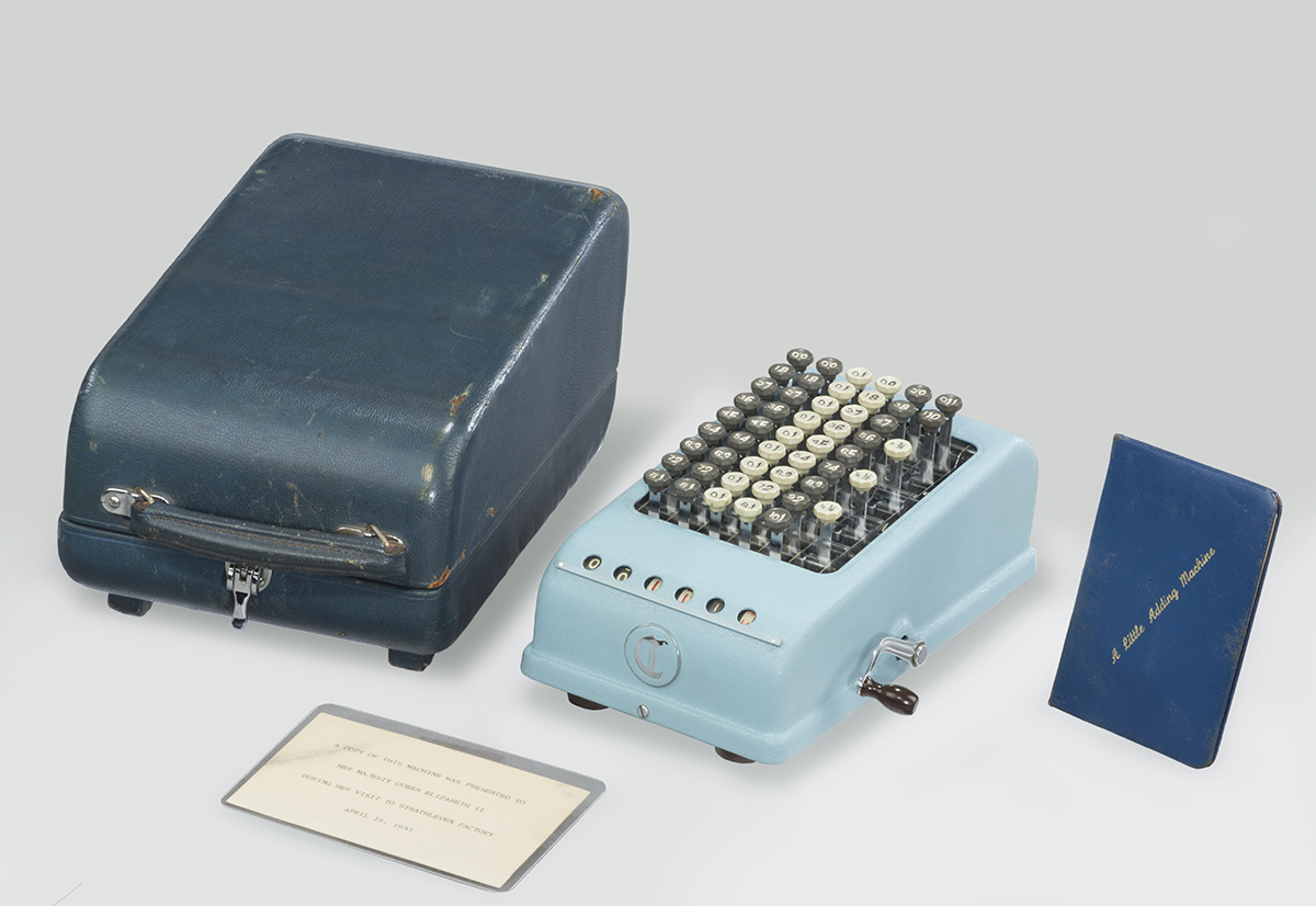 Copy of a Custom "Baby Calculator" Presented to Queen Elizabeth II for Prince Charles, 1953 Baby blue adding machine with dark turquoise cover and two cards