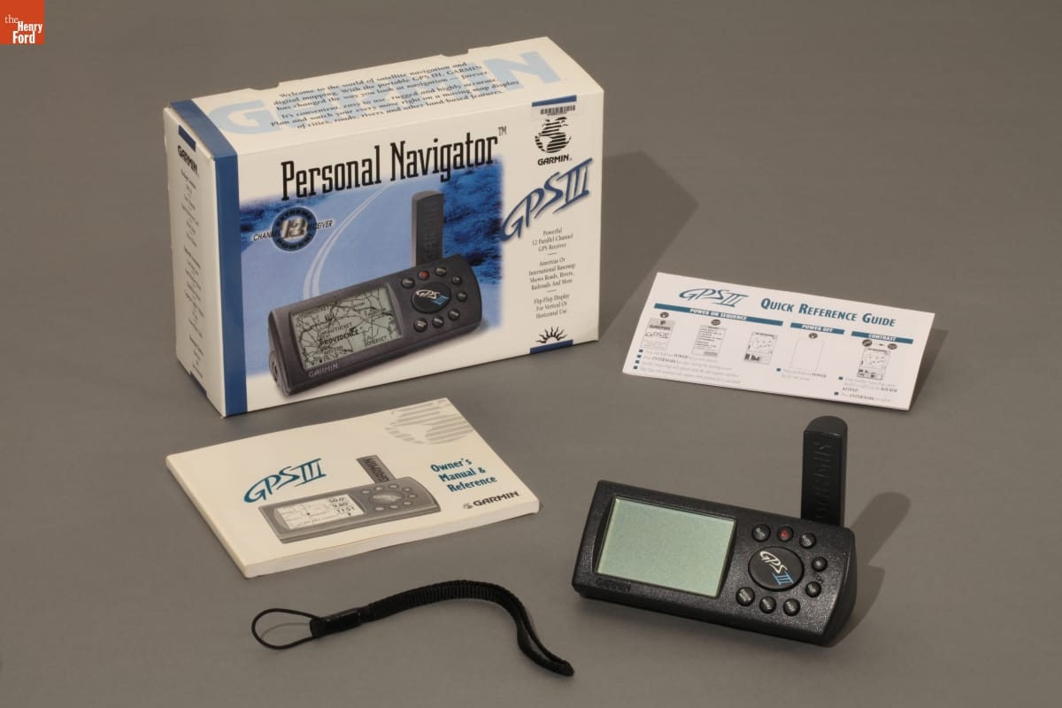 Garmin "Personal Navigator" GPS System, 1998 Small electronic device, cord, instruction manual, "quick reference guide," and box for GPS system