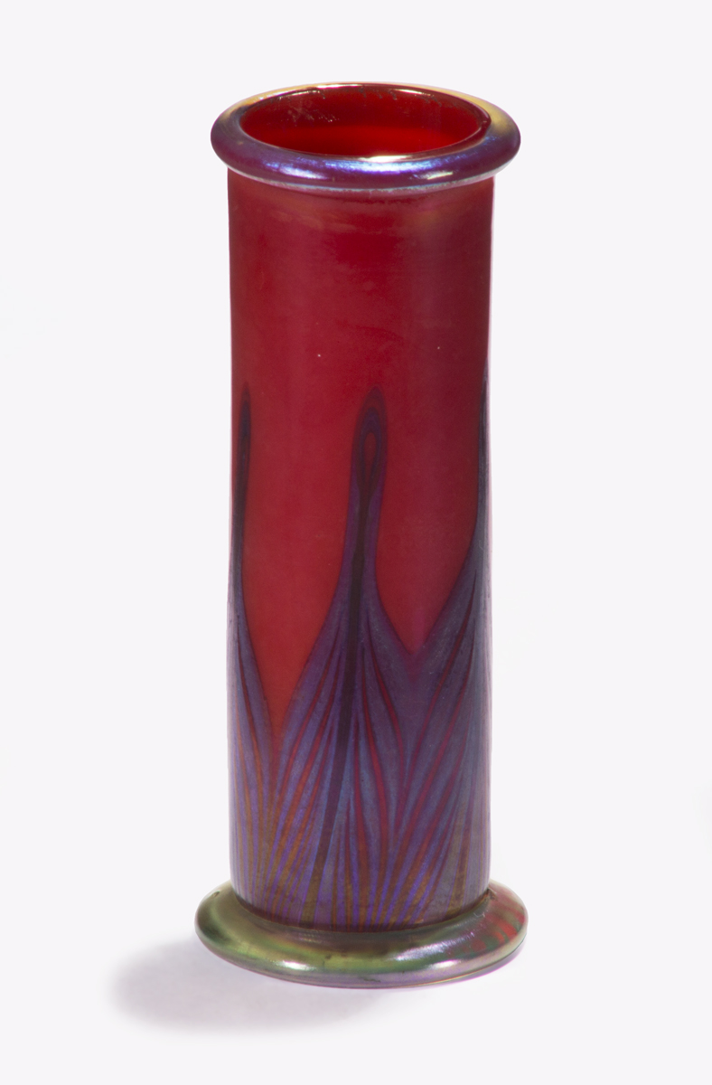 Favrile Vase, 1901-1915 Narrow red vase with blue-and-red abstracted "peacock feather" pattern on bottom