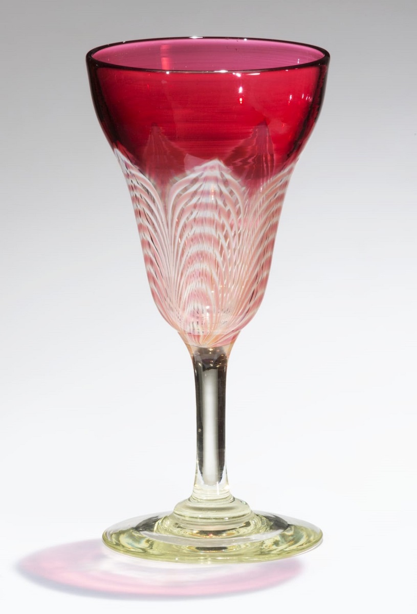 Goblet, 1924-1931 Glass goblet with clear or slightly greenish base and stem, and pattern on body of white and red arcs changing to solid red at top