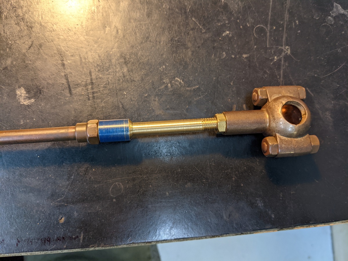 Extension fabricated by Andrew Ganem Metal piping or tubing with round shape with bolts on end