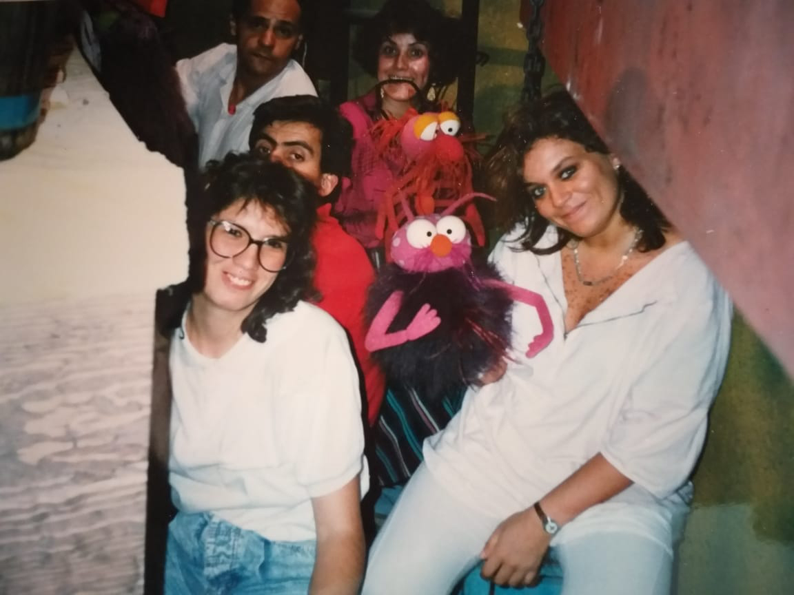 Carmen Osbahr-Vertiz working on the children’s television show Super Ondas Group of people in tight space, several holding puppets