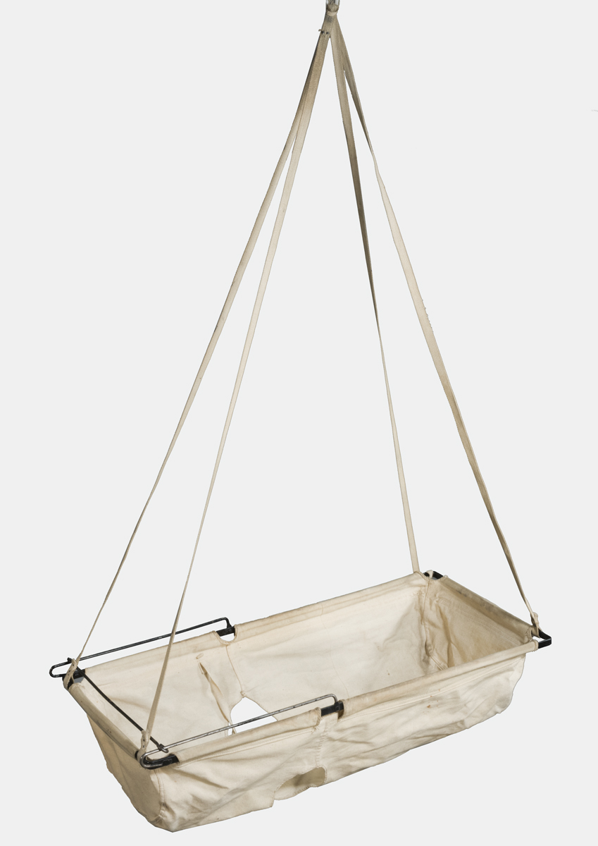 Baby Swing, 1930 Beige fabric forming a type of hammock, suspended from rectangular frame and four ropes